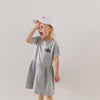 toddler girl wearing mini ceo dress and mini ceo white hat with pink embroidery