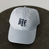 light blue baseball cap with navy embroidery saying mini bff