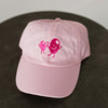 light pink baseball cap for toddler with dark pink embroidery "Olive BFF's" on front of hat