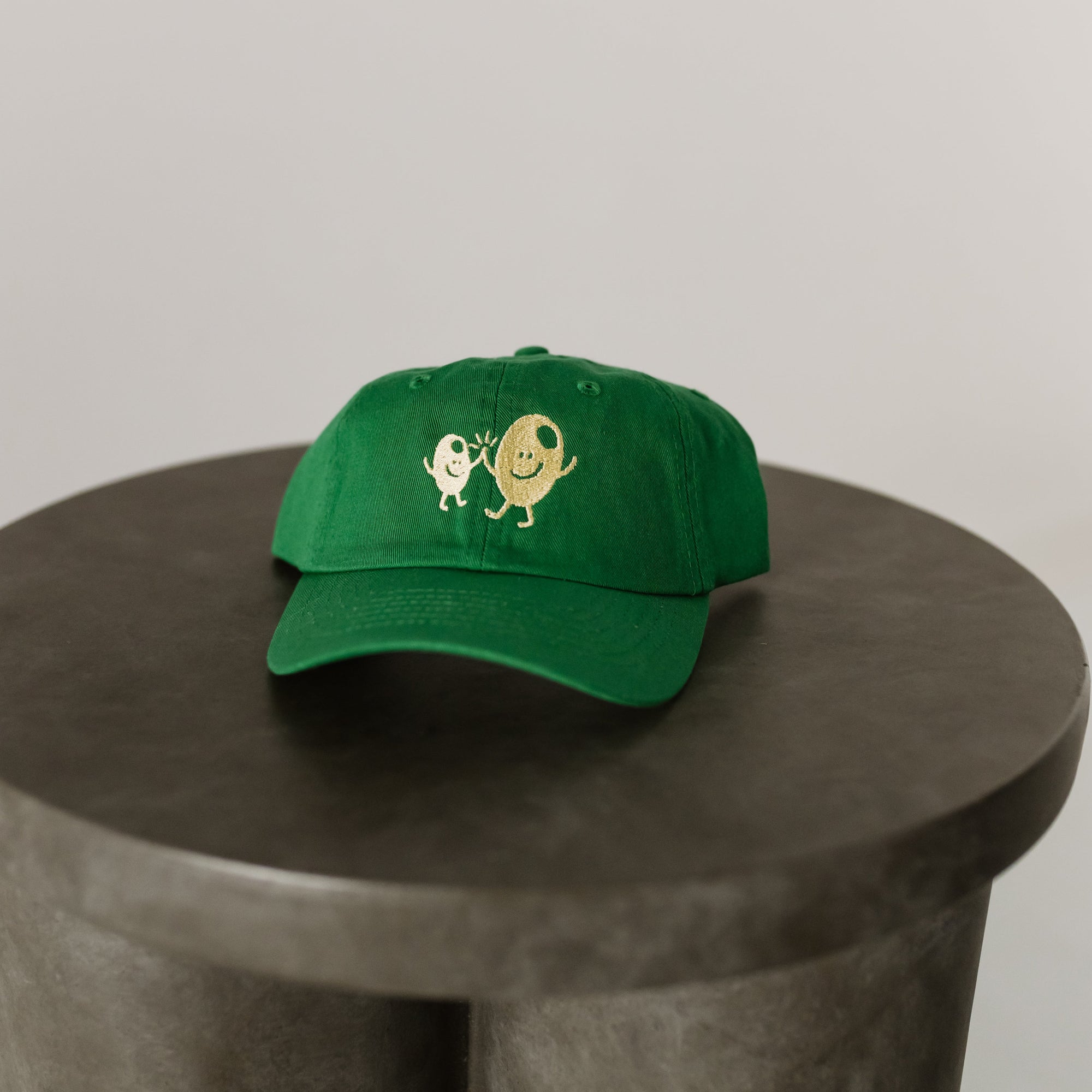green baseball cap for toddler with light green embroidery "Olive BFF's" on front of hat