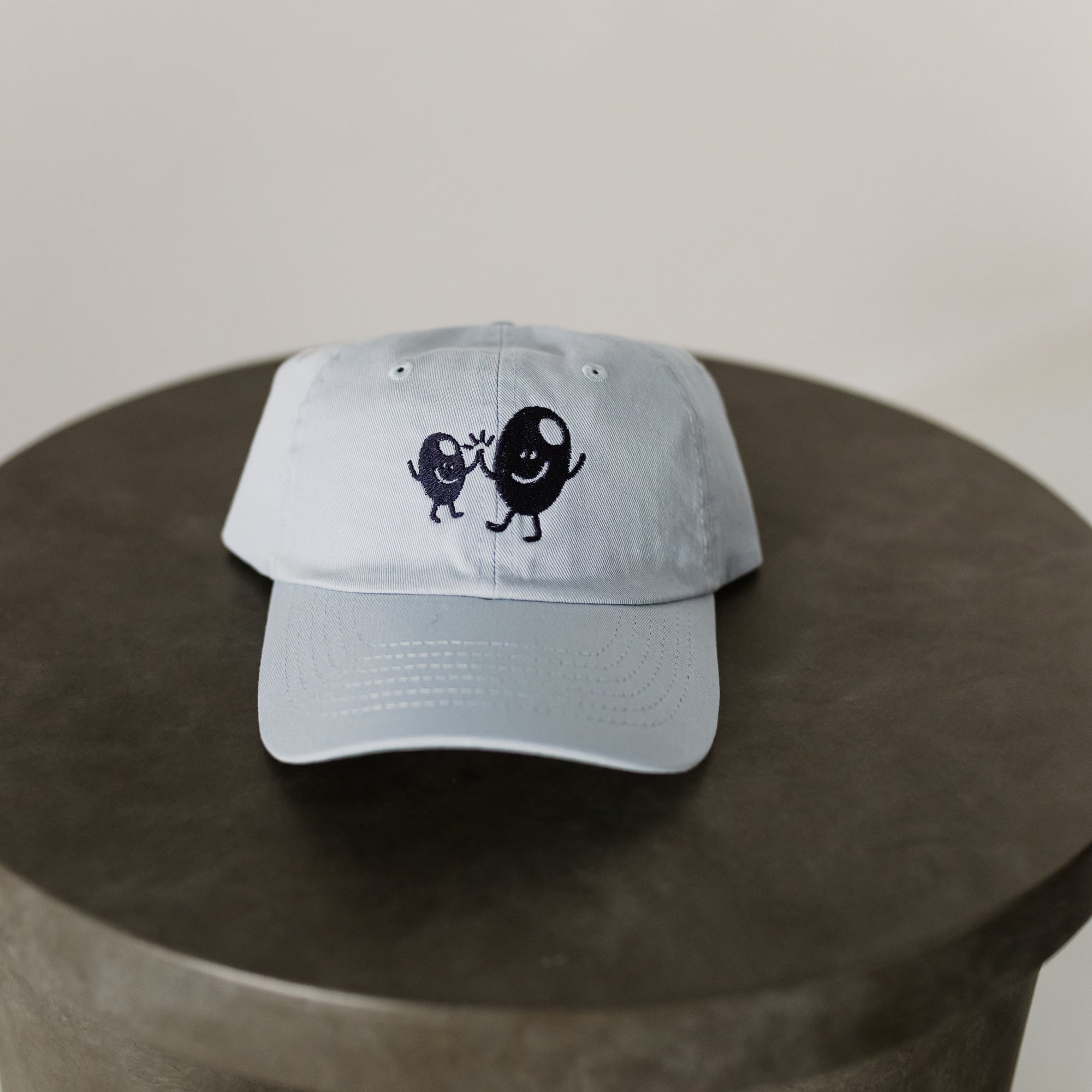 light blue baseball cap for toddler with navy embroidery "Olive BFF's" on front of hat