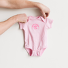 light pink infant bodysuit with newest member bff club screenprinted in pink